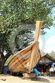 KRABI, THAILAND Ã¢â¬â MARCH 13: Shipwright building a boat by wood photo